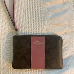 Coach brown and mauve monogram wristlet